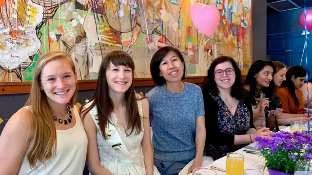 Kimberly Ha in a restaurant with friends