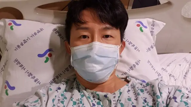 Ho Song em cama de hospital