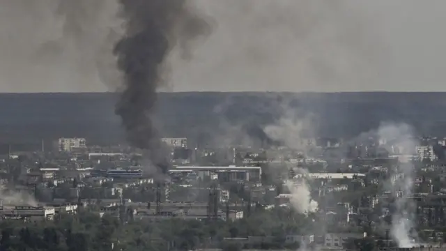 Smoke and dirt rise from the city of Severodonetsk during fighting between Ukrainian and Russian troops at the eastern Ukrainian region of Donbas on June 14, 2022,
