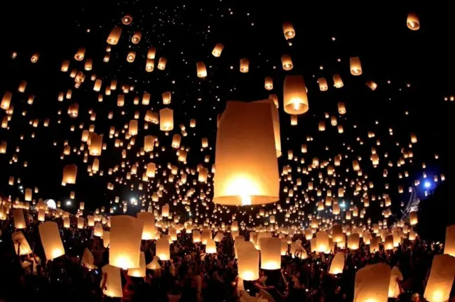 People release floating lanterns during the festival of Yee Peng in the northern capital of Chiang Mai