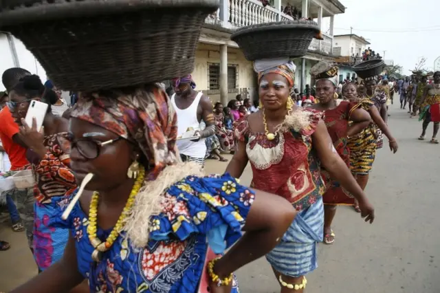 Ivorians take part in a parade on the last day of the Popo Carnival in Bonoua, south of Abidjan.