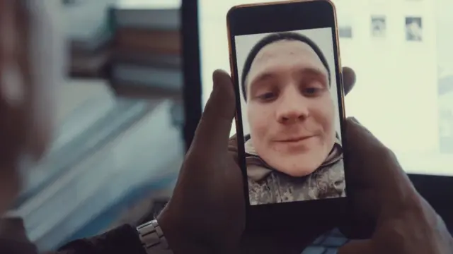 Vanya calling his family before leaving for the front line