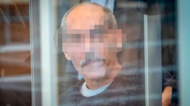 Syrian defendant Anwar Raslan arrives at court for an unprecedented trial on state-sponsored torture in Syria, on April 23, 2020 at court in Koblenz, western Germany