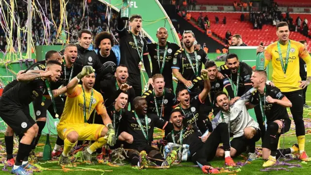 Man City celebrate the League Cup win in March 2020