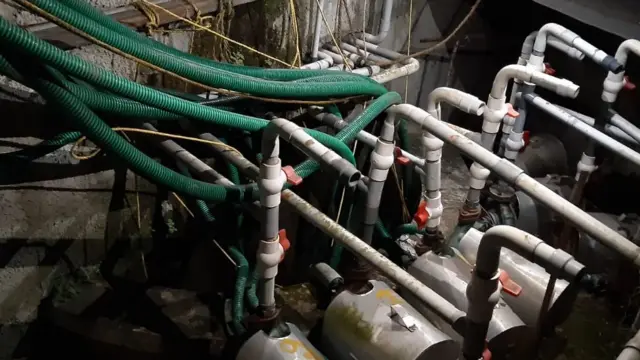 ওই ভবনের পানি সরবরাহকারী কূপের সমস্ত পানি পাম্প দিয়ে বের করা হচ্ছে।