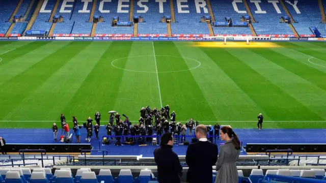 Prince William, Duke of Cambridge (2R) and Britain"s Catherine, Duchess of Cambridge (R) during their visit to the King Power Stadium