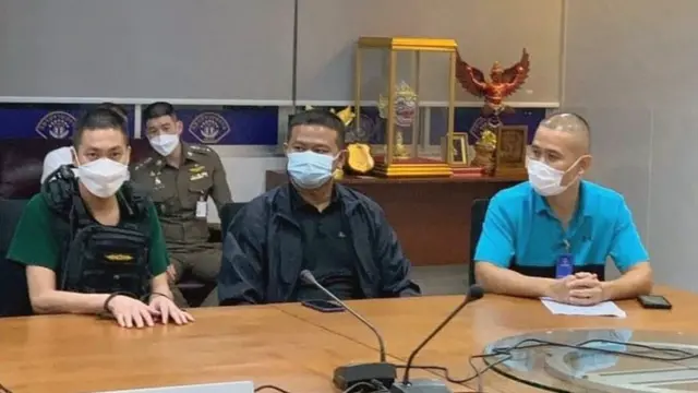 ภาพผู้ต้องหาและตำรวจ