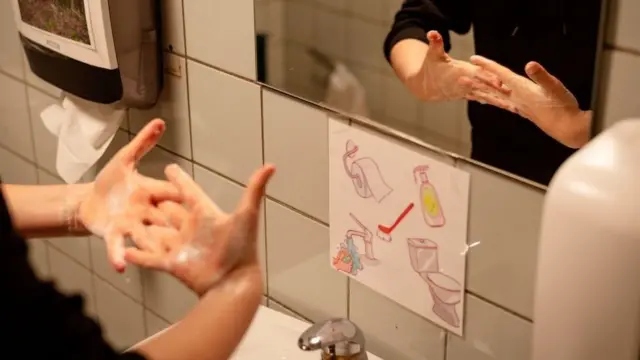 Woman washing her hands