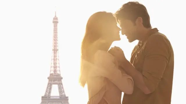 A man and a woman gaze into each others eyes