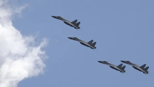J-11B fighter jets of the Chinese Air Force fly in formation during a training session for the upcoming parade marking the 70th anniversary of the end of World War Two, on the outskirts of Beijing on 2 July 2015.