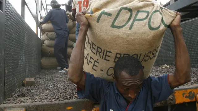 Man carrying cocoa