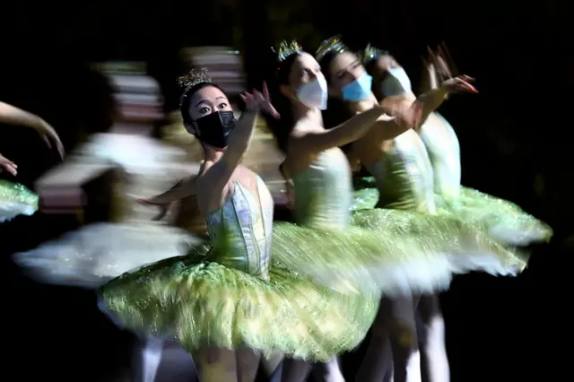 Dancers from the Berlin State Ballet - Staatsballett Berlin - wear face masks as they perform during the dress rehearsal of Don Quixote at the Deutsche Oper opera house in Berlin, Germany, on 1 December 2021