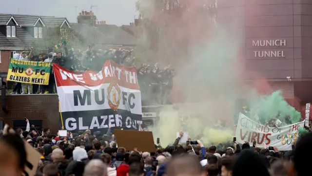 Manchester United fans protest outside Old Trafford against the club's ownership under the Glazer family