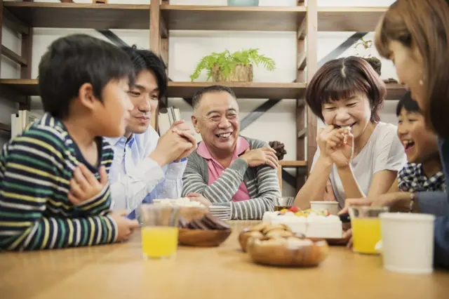 Multi-generation family at a grandfathers birthday party