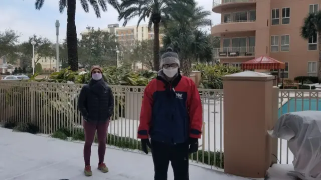 Eka Clarawati dan suaminya di depan apartemen mereka.