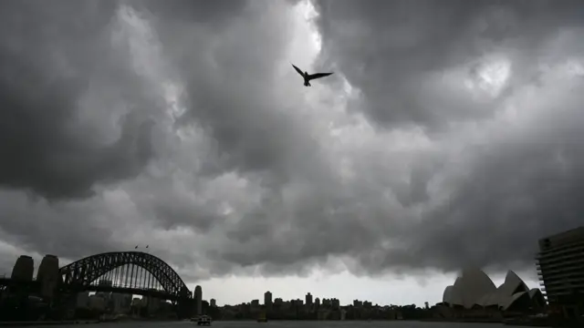 Storm clouds gather over Sydney Harbour on January 20. Gajimare ya taru a tashar jiragen ruwan Sydney a ranar 20 ga watan Janairu.