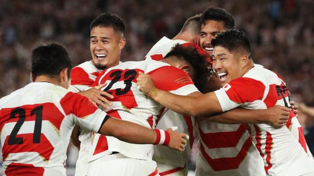 Japan players celebrate victory after the Rugby World Cup 2019