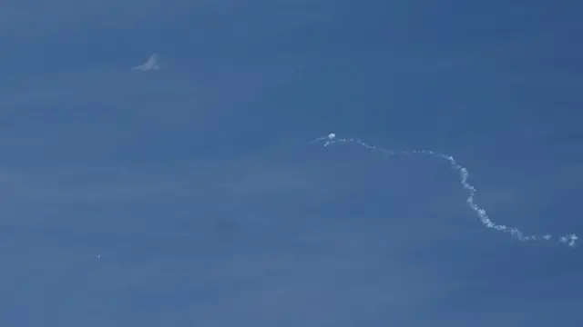 A view of what is believed to be a suspected Chinese spy balloon when it was shot down, seen from Holden Beach, U.S., February 4, 2023.