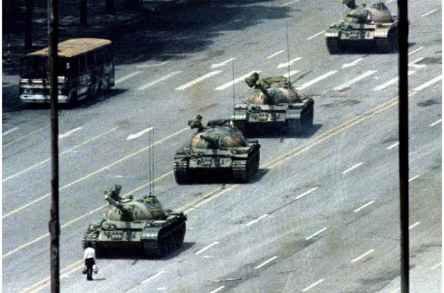 A Beijing citizen stands in front of tanks on the Avenue of Eternal Peace in this June 5, 1989 file photo during the crushing of the Tiananmen Square uprising. June 4 marks the 25th anniversary of the suppression of pro-democracy protests in Tiananmen Square in 1989. Picture taken June 5, 1989. REUTERS/Stringer/Files
