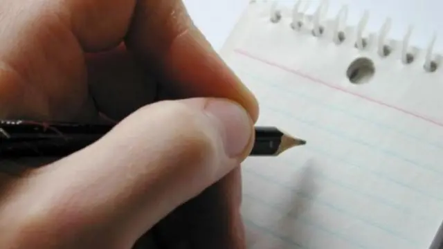 Mão esrevendocbet cassinocaderno