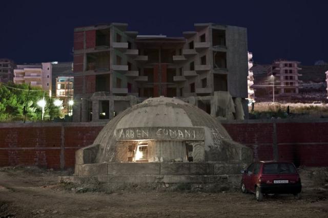 Bunker in Albania next to buildings
