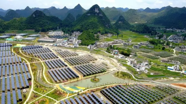 Greenhouses with solar panels on their roofs, in Yang Fang village in Anlong, in China's southwest Guizhou province