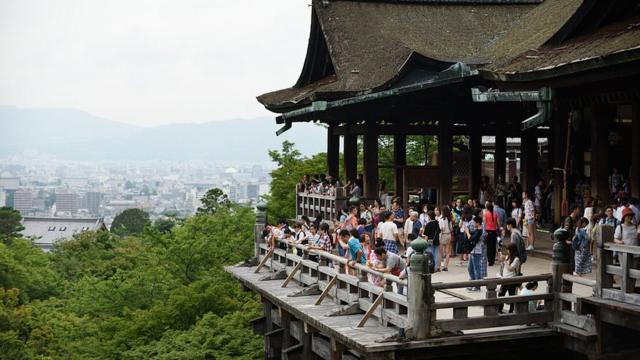Tourists at a temple in Kyoto
