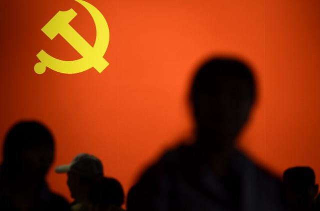 This picture taken on October 10, 2017 shows a party flag of the Chinese Communist Party displayed at an exhibition showcasing China's progress in the past five years at the Beijing Exhibition Center. China's police and censorship organs have kicked into high gear to ensure that the party's week-long, twice-a-decade congress goes smoothly when it begins on October 18. / AFP PHOTO / WANG ZHAO / TO GO WITH CHINA-POLITICS-SECURITY, FOCUS BY BECKY DAVIS (Photo credit should read WANG ZHAO/AFP/Getty Images)