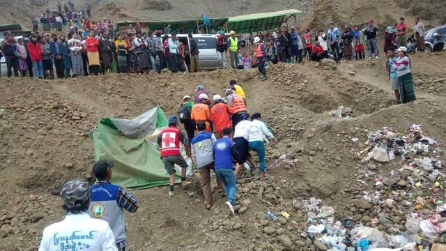 Myanmar emergency services conduct a search and rescue operation after an accident at a jade mining site in Hpakant, Kachin State, northern Myanmar, 22 December 2021