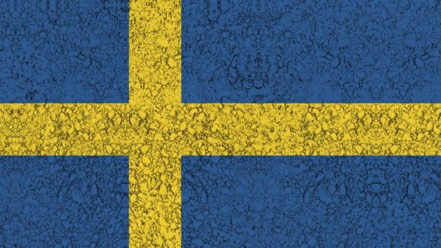 Bandeira sueca pintada no asfalto