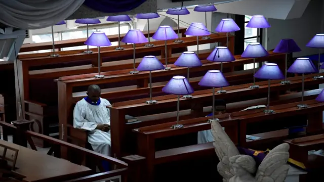 Two choir members attend the service at the Methodist Church of Trinity in Lagos, Nigeria - Sunday 22 March 2020