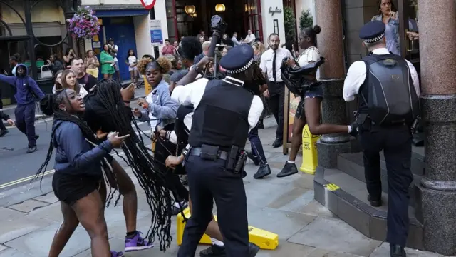 Police clash with youths outside McDonald's