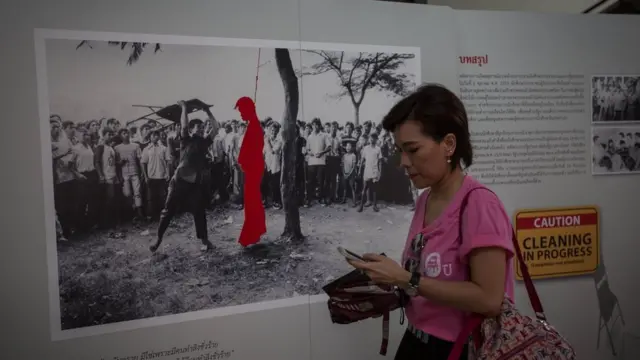 People visit the 40th anniversary memorial exhibition inside the Thammasat University Oct. 6, 1976,