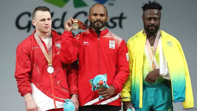 (L-R) Silver medalist Jack Oliver of England, gold medalist Sathish Kumar Sivalingam of India and bronze medalist Francois Etoundi of Australia pose during the medal ceremony for the Men's 77kg Weightlifting Final on day three of the Gold Coast 2018 Commonwealth Games at Carrara Sports and Leisure Centre on April 7, 2018