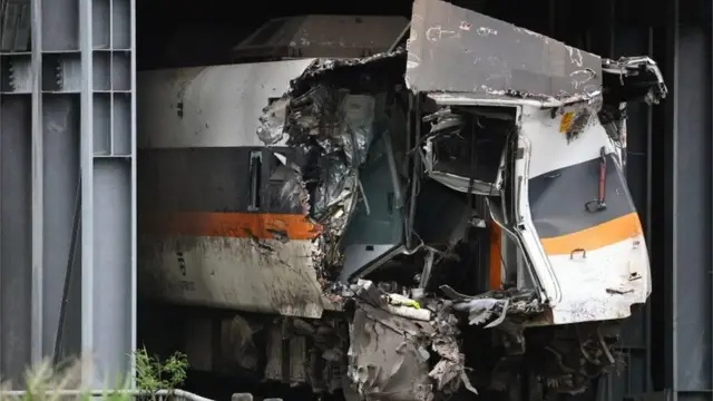 A damaged train carriage extracted from a tunnel is seen at the site after the deadly train derailment north of Hualien, Taiwan April 6, 2021.
