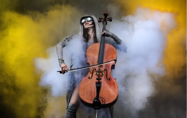 Cellist surrounded by smoke
