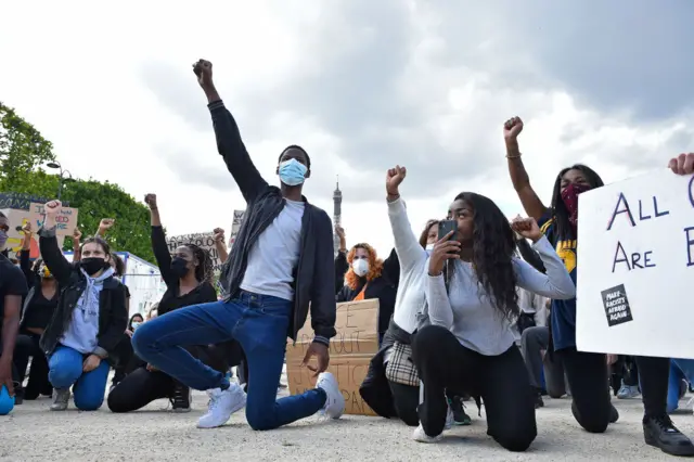 Protesters take a knee in Paris