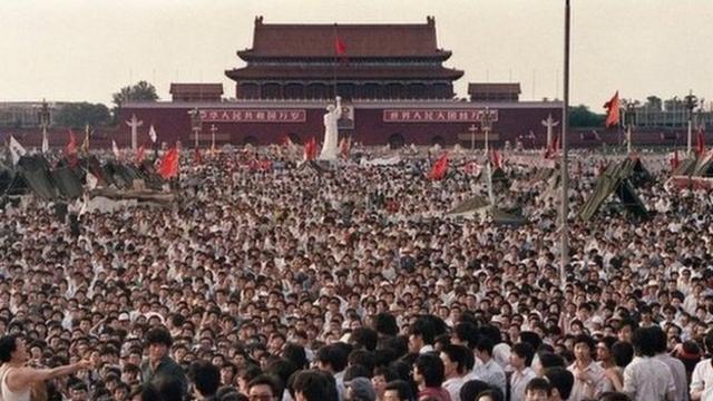 This file photo taken on 2 June 1989 shows hundreds of thousands of Chinese gathering around a 10-metre replica of the Statue of Liberty (C), called the Goddess of Democracy, in Tiananmen Square demanding democracy despite martial law in Beijing