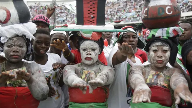 Supporters of Ghana Incumbent President, John Dramani Mahama candidate of the National Democratic Congress perform during a presidential election rally at Accra Sports Stadium in Accra, Ghana, Monday, Dec. 5, 2016. The Ghana election will take place on Dec. 7.