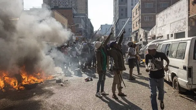 Protesters dey point towards pipo wey dem beliv say be undocumented foreign nationals demonstration march by di "March and March" and Operation Dudula movements wey bin mark di unofficial deadline wey citizen-led groups bin put for undocumented foreign nationals to leave South Africa, for Johannesburg, on June 30, 2026.