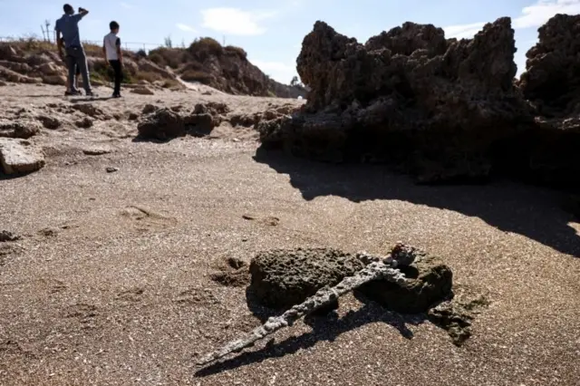 A sword believed to have belonged to a Crusader who sailed to the Holy Land almost a millennium ago lays on the beach near to where it was recovered from the Mediterranean seabed by an amateur diver, the Israel Antiquities Authority said, Caesarea, Israel October 18, 2021.