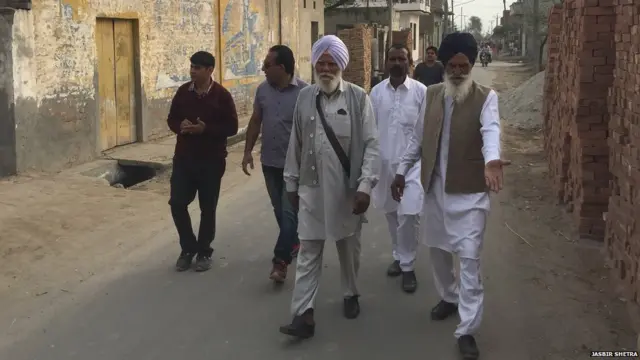 SHUBMAN'S GRANDFATHER ALONG WITH VILLAGERS