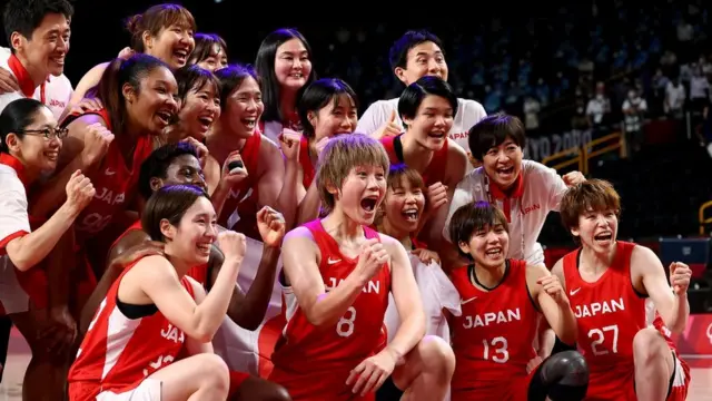 Tokyo 2020 Olympics - Basketball - Women - Gold medal match - United States v Japan - Saitama Super Arena, Saitama, Japan - August 8, 2021. Japan players pose for a picture after the match