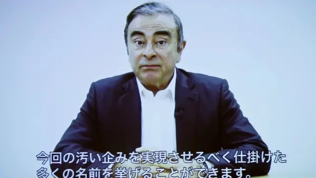 Carlos Ghosn delivering a video statement with Japanese captions in April 2019