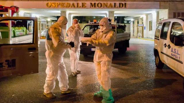 Doctors wear protective clothes against coronavirus in Naples