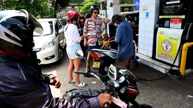 foreigners in fuel queues