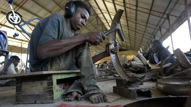 Man wit disability wey dey do welder work.