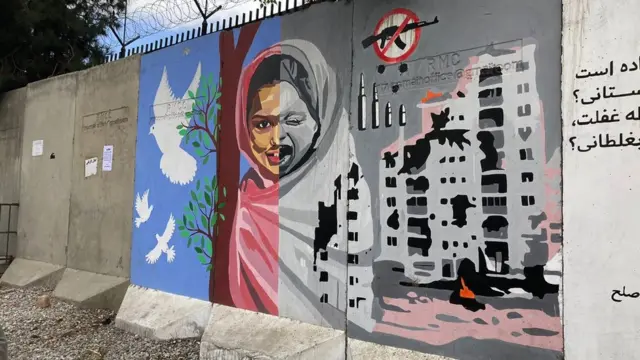 A mural painting depicting a girl's face - happy in times of peace, and shattered in times of war