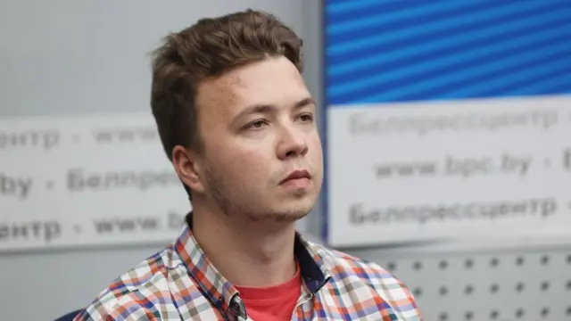 A handout photo made available by Belta shows Belarusian opposition activist Roman Protasevich attends a press conference by Belarusian Foreign Ministry on Ryanair Athens-Vilnius flight on 23 May at the National Press Center in Minsk, Belarus, 14 June 2021.