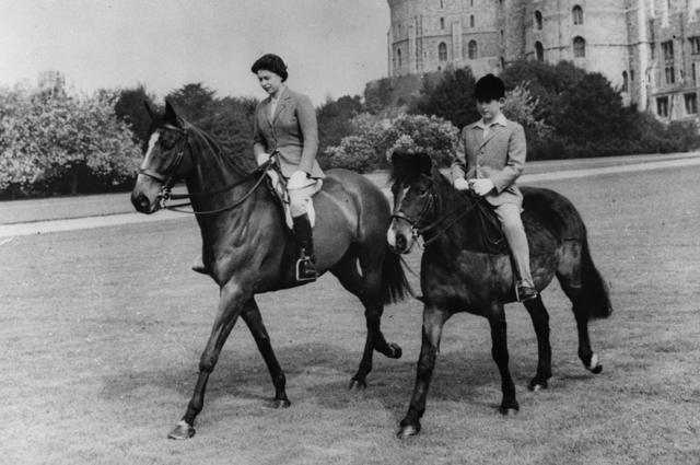 Queen Elizabeth II and her son, Prince Charles, out riding at Windsor Castle